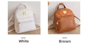 Detail view of mini quilted backpacks in white and brown with golden zipper accents