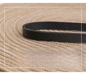 Detail of high-quality black faux leather shoulder strap with smooth finished edges