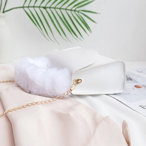 Elegant white faux leather crossbody bag with plush fur trim and golden chain strap