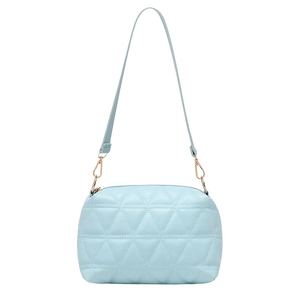Light blue quilted pillow bag with diamond stitching and adjustable leather shoulder strap