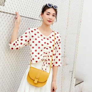 Bright yellow leather saddle bag with adjustable shoulder strap for summer fashion
