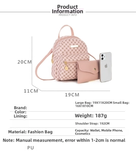 Pink PU leather mini backpack and envelope pouch set shown with phone for size scale