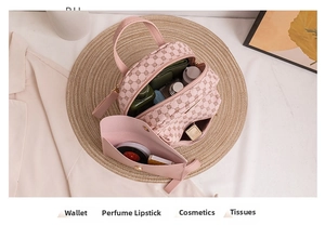 Pink monogram backpack interior view showing large storage for wallet and cosmetics