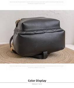Close-up of the black quilted backpack bottom featuring premium lychee texture leather