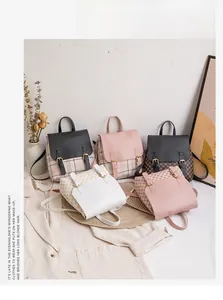 Detail view of mini backpacks in various prints and textures displayed with fashion props