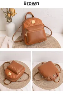 Close-up details of brown quilted mini backpack showing front pocket and golden hardware