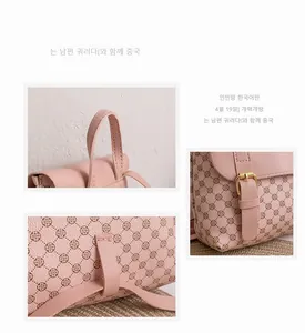 Close-up of pink backpack showing clover print, metal buckle and reinforced stitching