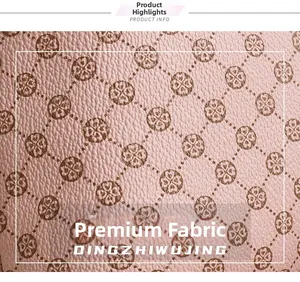Close-up of premium light purple synthetic leather with embossed clover monogram pattern