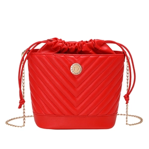 Elegant red bucket bag for women with V-shaped quilting and gold metal chain strap