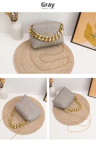 Detailed views of grey quilted small square bag with gold chain and metal logo plate