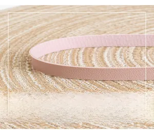 Detail of pink-brown lychee texture leather shoulder strap with neat stitching craft
