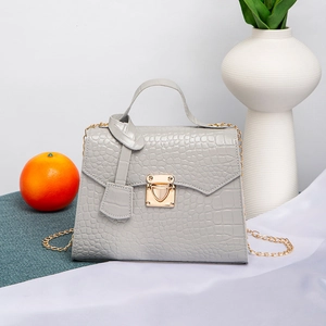Gray crocodile pattern leather handbag with gold chain strap and elegant hardware