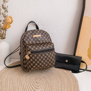 Mini brown monogram backpack and black flap pouch set on a woven mat for women