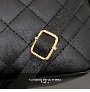 Macro detail of adjustable golden metal buckle on black quilted leather strap