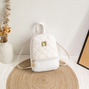 Fashionable white quilted mini backpack with gold hardware and rhombic stitching details