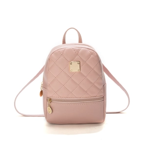 Pink quilted mini backpack with gold hardware and embroidery for modern fashion styling