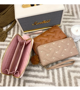 Detailed interior view of a long woven wallet with card slots and a zipper pocket