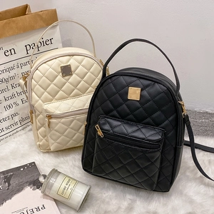 Chic quilted rhombic backpack for women in cream and black with gold hardware accents