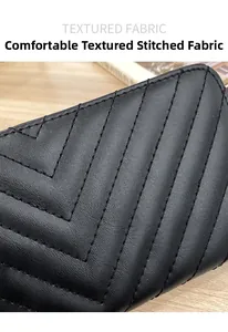 Close-up of black leather wallet featuring elegant V-shaped quilted stitching and texture