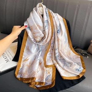 Elegant floral print satin silk shawl featuring a soft beige base and wide brown border