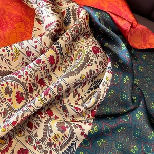 Vintage paisley and geometric silk-like satin scarves in colorful multi-layered patterns