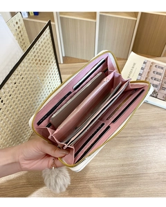 Internal view of women's long zipper wallet with 8 card slots and pink lining detail