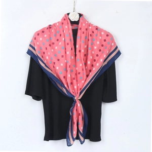Pink geometric pattern cotton linen scarf with blue striped border on white background