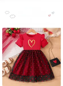 Detail of red ribbed top and black heart-patterned tulle skirt for little girls