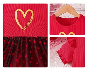 Detail of red ribbed bodice with gold heart print and black mesh skirt for girls