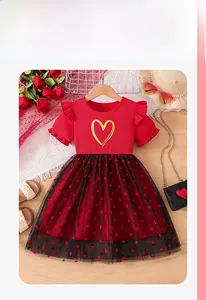 Detail of red knit bodice with gold heart and black tulle skirt with red flocked hearts