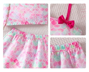 Detail of mermaid scale print and elastic waist on pink and green girls' outfit