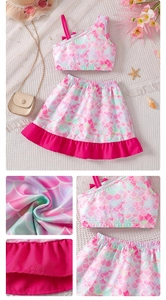Detail of girls mermaid scale print set with ruffle hem and one-shoulder top