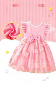 Detail of pink flower embroidery on girls mesh dress with flutter sleeves and bow