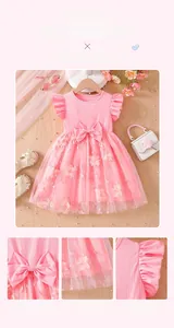 Detail view of pink girls' princess dress with floral embroidery and mesh tulle layering