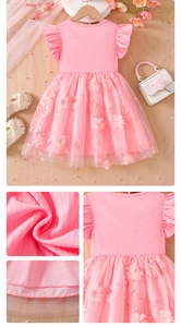 Detail of pink girls dress with flutter sleeves and floral embroidery on tulle skirt