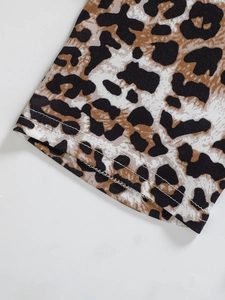 Detailed macro view of leopard print fabric with high-quality double-needle stitching seams