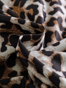 Macro view of soft leopard print fabric texture for toddler girls summer outfit