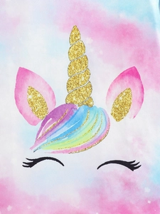 Detailed close-up of rainbow unicorn print with golden glitter horn on infant cotton top