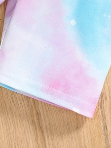 Detail of colorful tie-dye baby clothes showing high-quality double-needle stitching