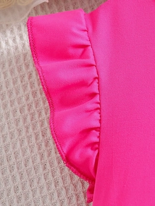 Detail of rose pink ruffle sleeve with fine stitching on girls summer fashion outfit