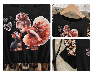 Detail of baby girl dress with cartoon print and leopard mesh tutu skirt layering