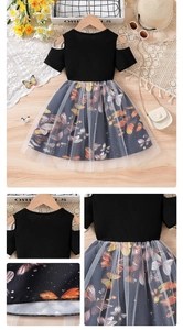 Detail of girls' off-shoulder dress featuring butterfly print and soft mesh overlay