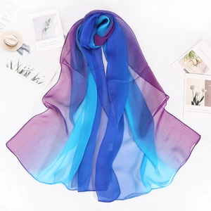 Lightweight rainbow gradient silk scarf in blue and purple hues for summer protection