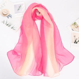 Detailed texture of lightweight gradient pink and peach georgette chiffon scarf