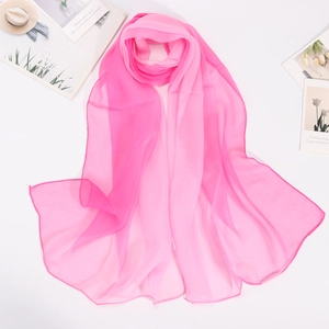 Close-up of lightweight rose pink chiffon silk scarf with delicate rolled edges