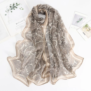 Detailed view of lightweight georgette scarf with retro paisley pattern and fine edges
