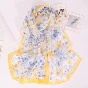Floral chiffon scarf with yellow sunflowers and purple blossoms on white fabric
