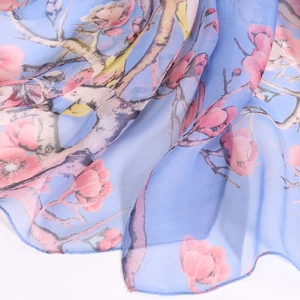 Lightweight sky blue georgette scarf with elegant pink floral print and sheer texture