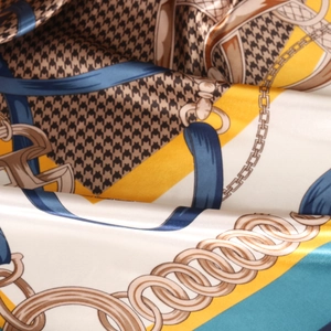90cm silk scarf featuring retro houndstooth and chain prints in elegant mustard and teal colors