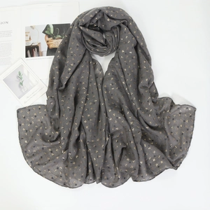 Dark grey cotton linen hijab scarf with golden leaf patterns on white background
